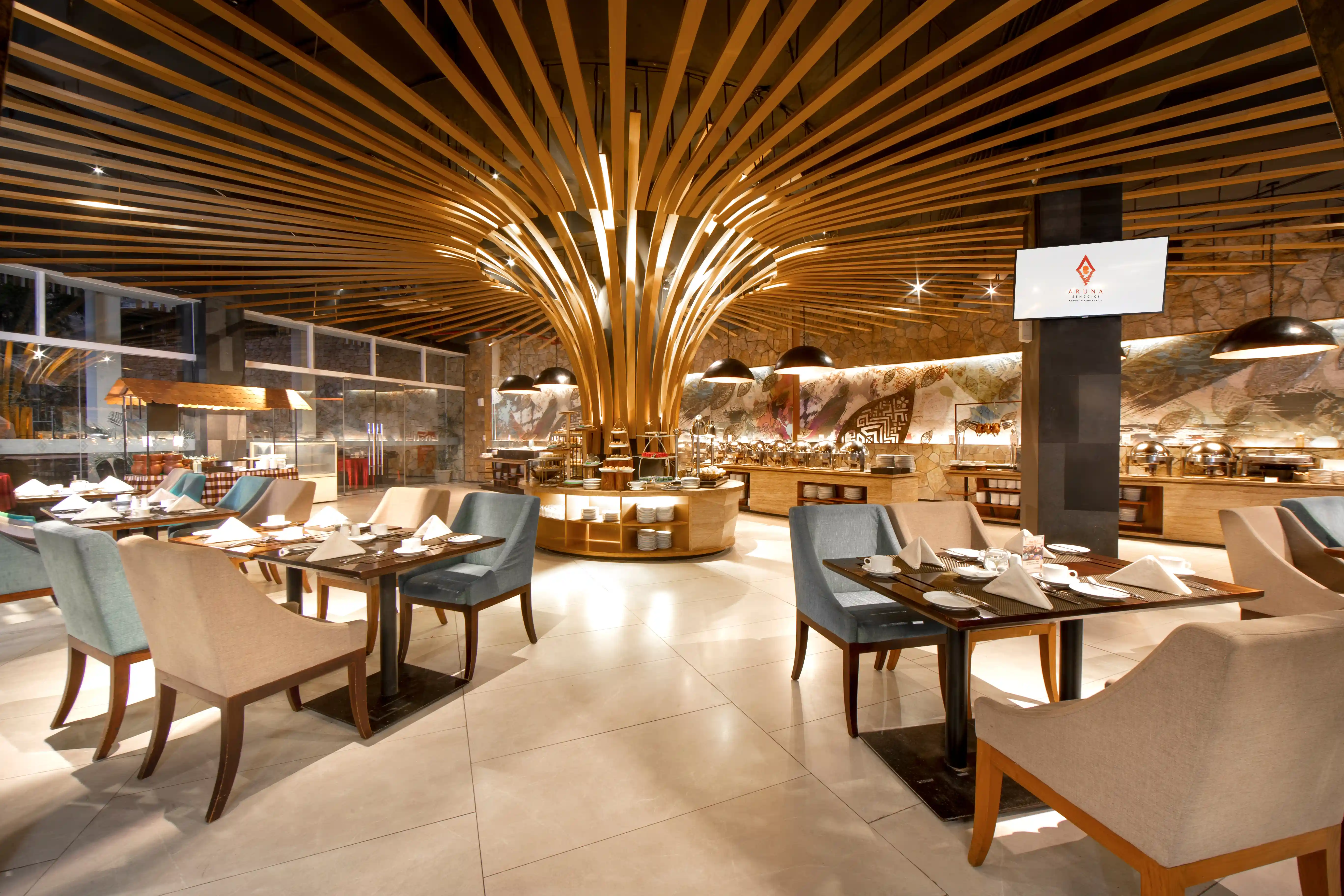 Elegant restaurant featuring a central buffet under a monumental wooden slat ceiling design.