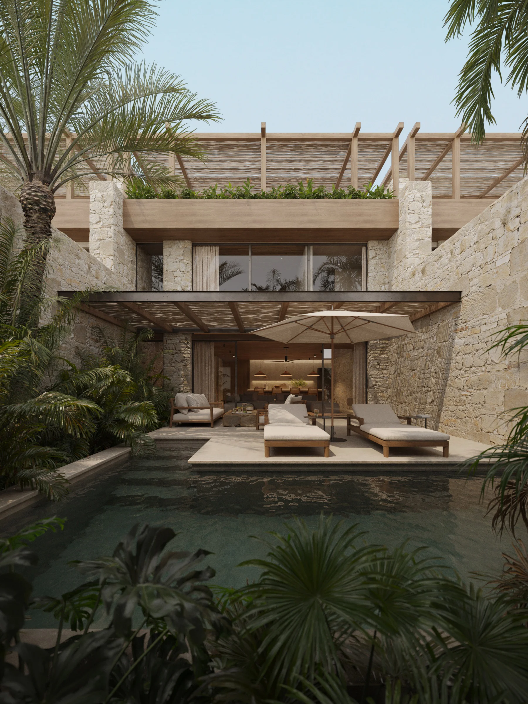 Stone courtyard featuring a private pool, loungers, and tropical plants.